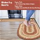 Chic Barcelona Gold - Burgundy Braided Oval Rug enhancing a kitchen