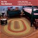 bedroom red oval braided rug