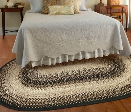 Black Bedroom Braided Rug In Front Of The Bed